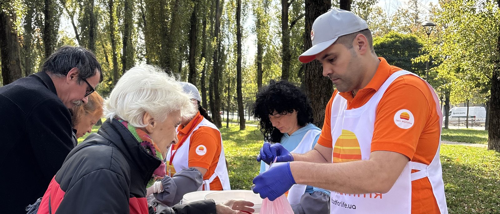 Food for Life volunteers handing out fruit